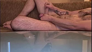 Play Solo handjob on couch in hotel room