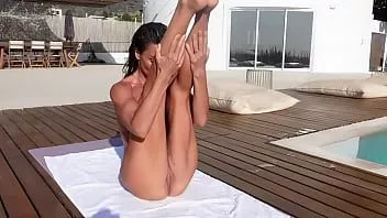 Play Wet, naked yoga by the pool with rixy fox