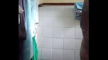 play Vaibhav jerks off & cums into a white plastic container in the bathroom